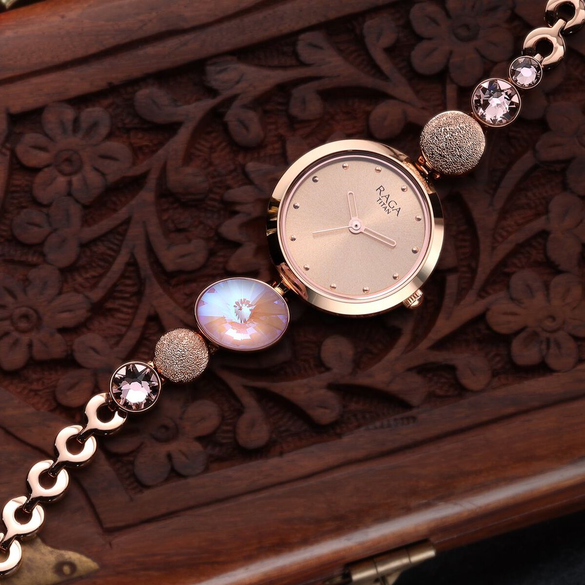 Raga Women's Charm: Elegant Mother of Pearl Dial with Ornate Strap Watch 1